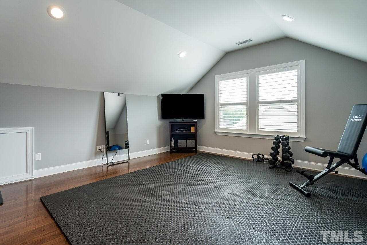5268 Aleppo Lane Raleigh, NC 27613 - Photo 25 of 30 Third floor features spacious rec room, attic storage space, bedroom and full bathroom!