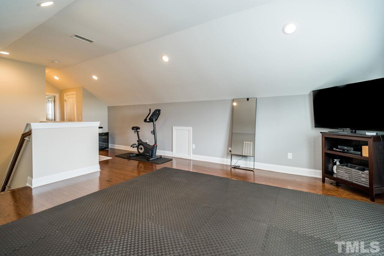 5268 Aleppo Lane Raleigh, NC 27613 - Photo 26 of 30 Third floor features spacious rec room, attic storage space, bedroom and full bathroom!