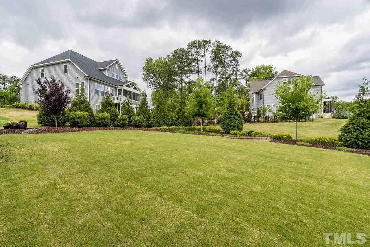 5268 Aleppo Lane Raleigh, NC 27613 - Photo 29 of 30 Luscious landscaping and plentiful hardscaping added to this yard along with irrigation!