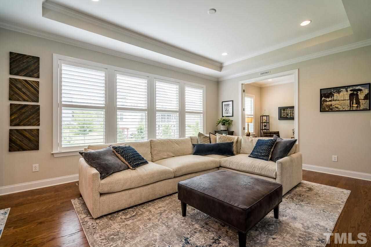 5268 Aleppo Lane Raleigh, NC 27613 - Photo 10 of 30 Recessed lighting with tray ceiling create ambiance in this open living room!