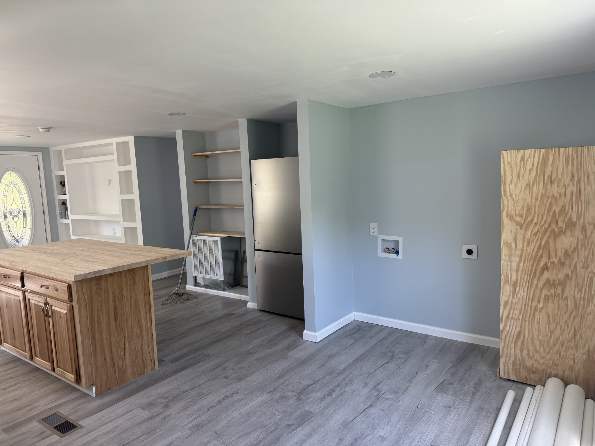499 Carter Blake Road Tullahoma, TN 37388 - Photo 2 of 15 a kitchen with a wooden floor and a refrigerator