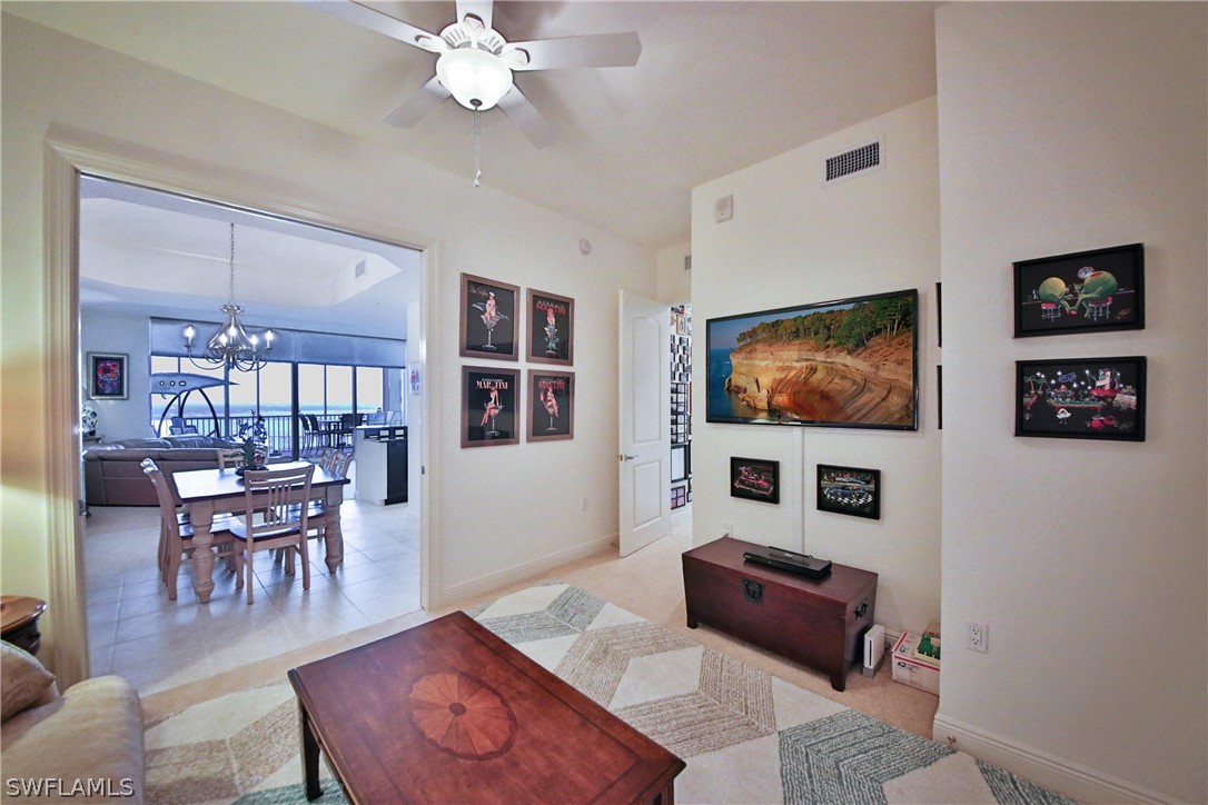 2090 West First Street, Unit 2107 Fort Myers, FL 33901 - Photo 15 of 35 a living room with furniture and a flat screen tv