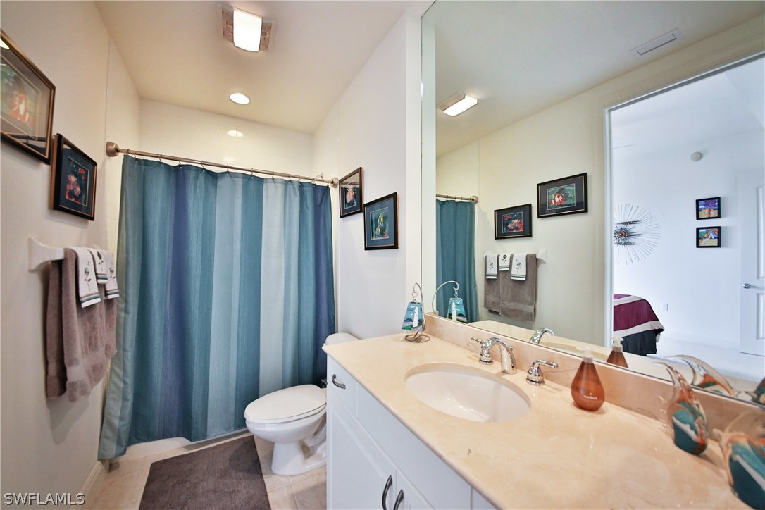 2090 West First Street, Unit 2107 Fort Myers, FL 33901 - Photo 21 of 35 a bathroom with a sink toilet and shower