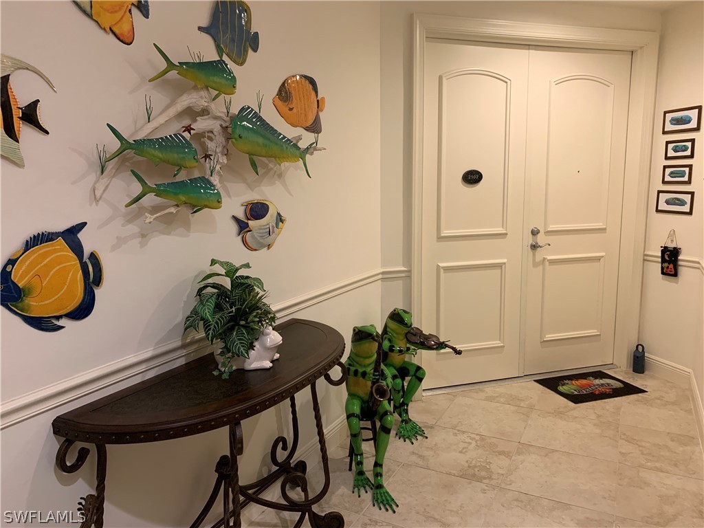 2090 West First Street, Unit 2107 Fort Myers, FL 33901 - Photo 26 of 35 a vase of flowers sitting on a table