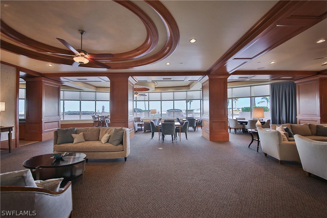 2090 West First Street, Unit 2107 Fort Myers, FL 33901 - Photo 33 of 35 a living room with furniture and a chandelier