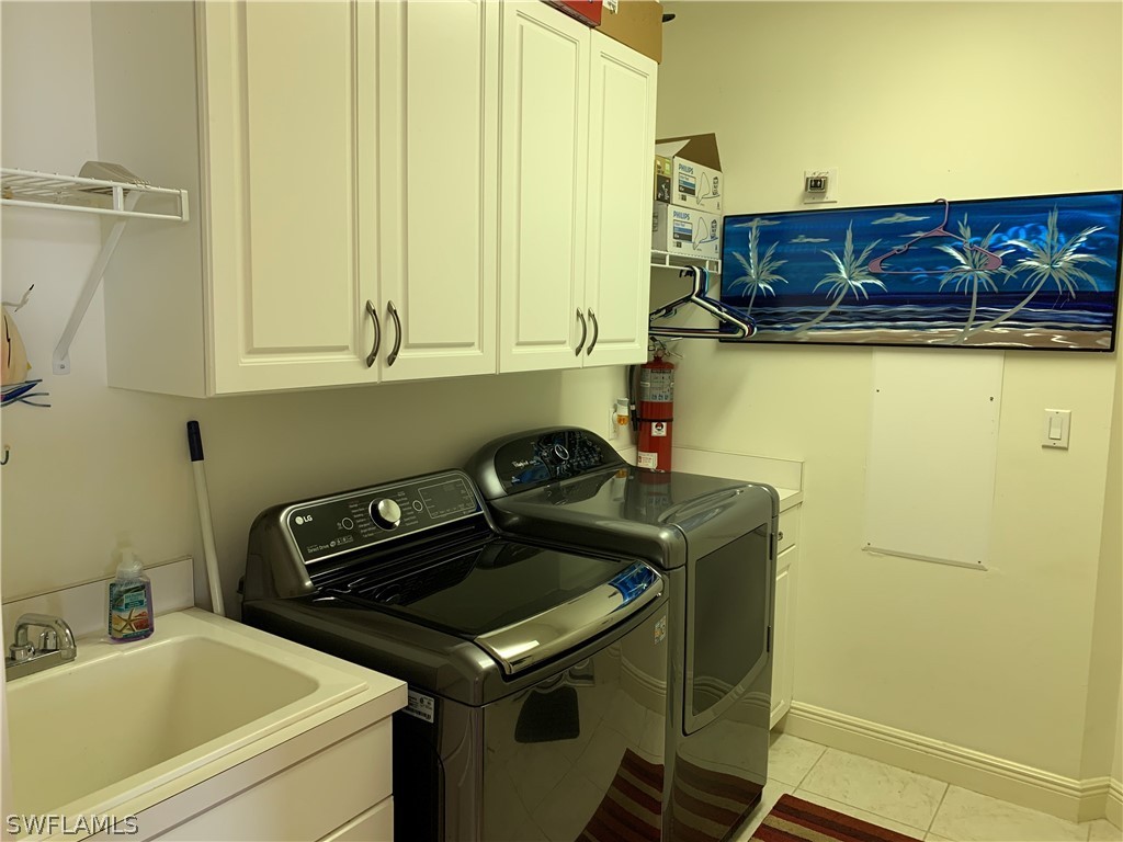 2090 West First Street, Unit 2107 Fort Myers, FL 33901 - Photo 5 of 35 a utility room with dryer and washer