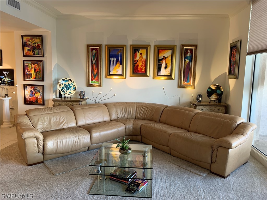 2090 West First Street, Unit 2107 Fort Myers, FL 33901 - Photo 10 of 35 a living room with furniture and wooden floor