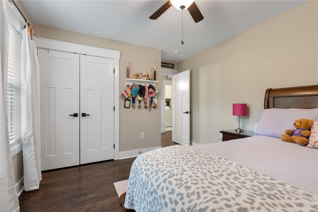 201 Hearthstone Drive Anderson, SC 29621 - Photo 26 of 49 Warm wood flooring extends throughout this naturally illuminated bedroom with a ceiling fan.