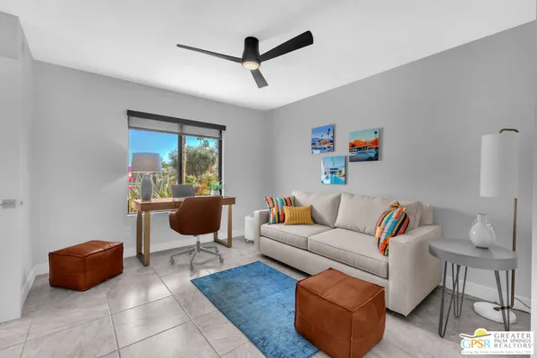 a living room with furniture and a window
