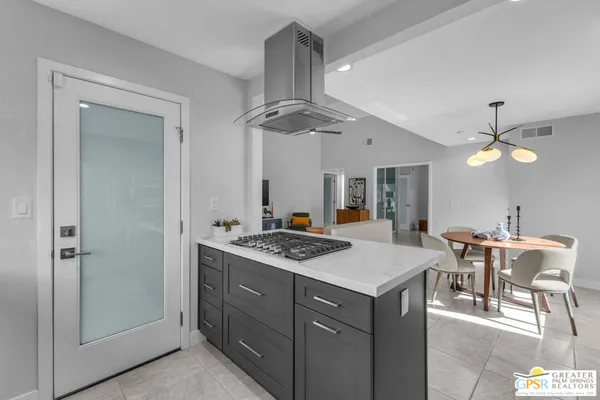 a kitchen with a table and chairs in it