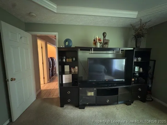 a bathroom with a granite countertop sink vanity mirror and toilet