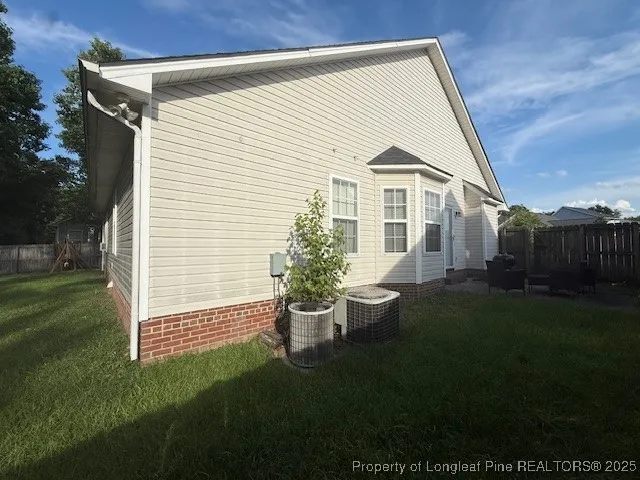 a backyard of a house with lots of green space