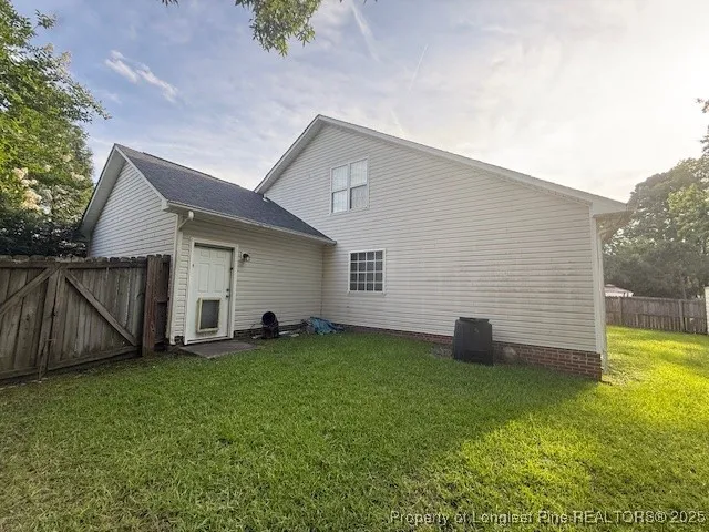 a view of a backyard with swings
