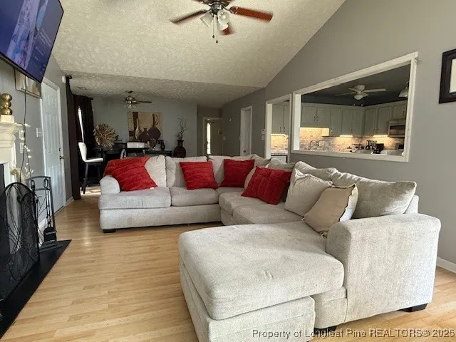 a living room with furniture and a rug