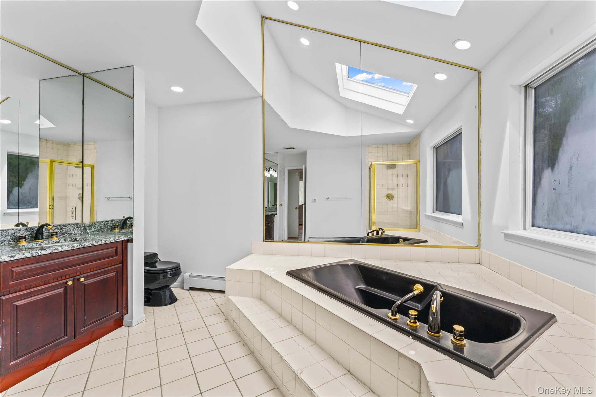 126 Bagatelle Road Melville, NY 11747 - Photo 32 of 50 a living room with stainless steel appliances kitchen island granite countertop a sink and cabinets