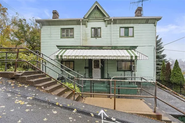 a front view of a house with a porch