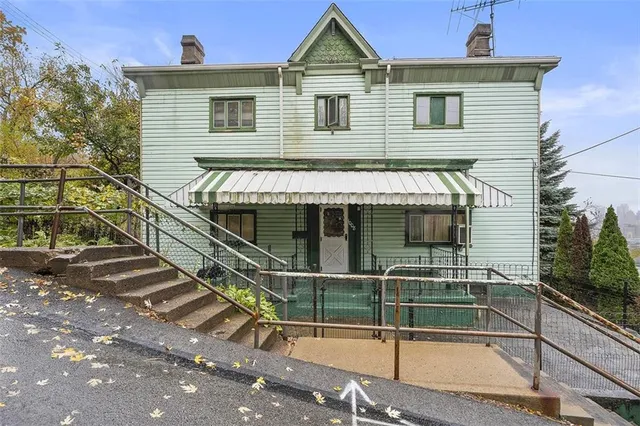 a front view of a house with a porch