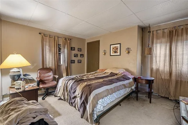 a bedroom with a bed and a closet