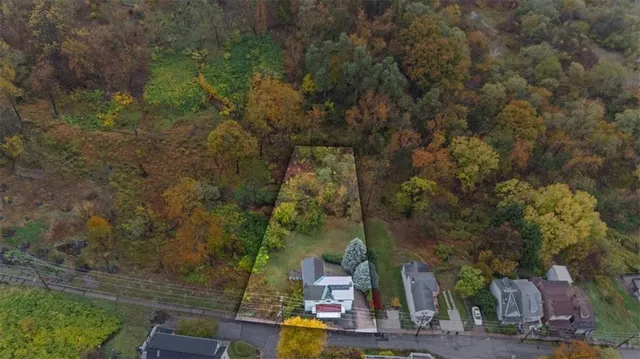an aerial view of residential house with outdoor space