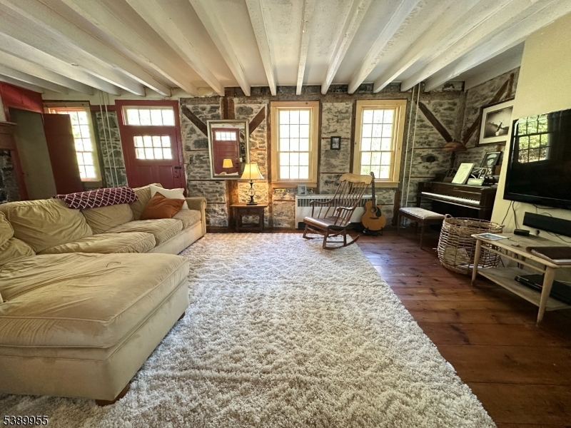 223 Federal Twist Road Stockton, NJ 08559 - Photo 12 of 28 a living room with furniture and a flat screen tv