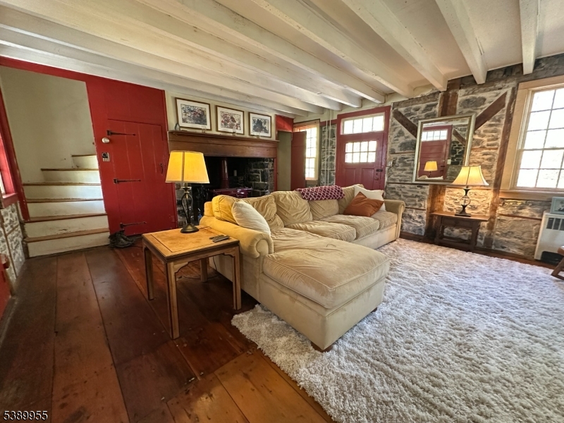 223 Federal Twist Road Stockton, NJ 08559 - Photo 13 of 28 a living room with furniture a fireplace and a table