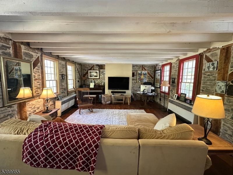 223 Federal Twist Road Stockton, NJ 08559 - Photo 14 of 28 a living room with furniture and a flat screen tv