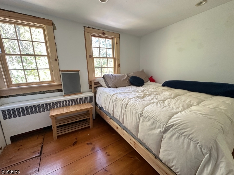 223 Federal Twist Road Stockton, NJ 08559 - Photo 18 of 28 a bedroom with a bed and a window