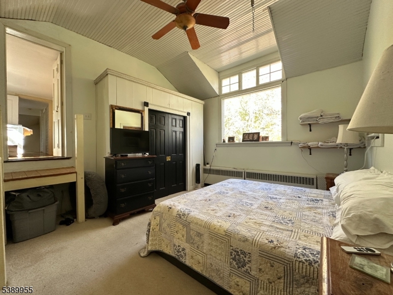 223 Federal Twist Road Stockton, NJ 08559 - Photo 23 of 28 a bedroom with a bed and a dresser