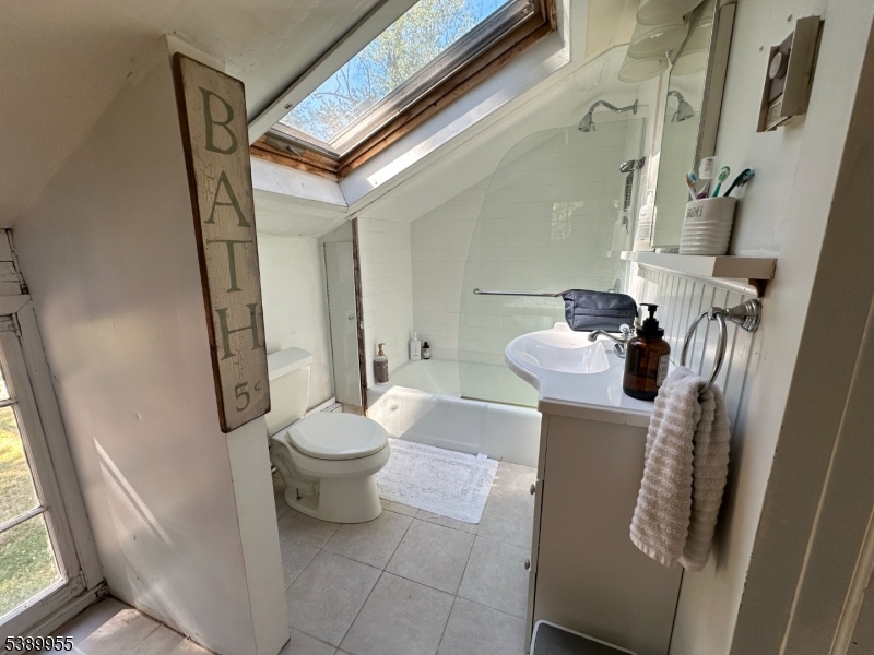 223 Federal Twist Road Stockton, NJ 08559 - Photo 24 of 28 a bathroom with a toilet and a mirror