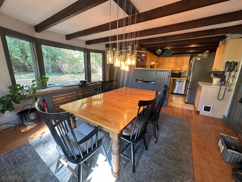 223 Federal Twist Road Stockton, NJ 08559 - Photo 4 of 28 a outdoor dining space with furniture and wooden floor