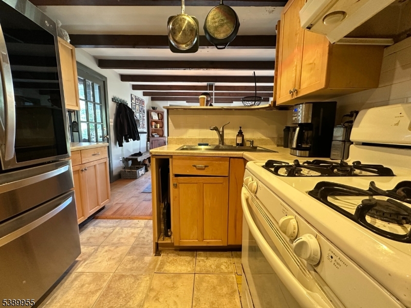 223 Federal Twist Road Stockton, NJ 08559 - Photo 7 of 28 a kitchen with a stove and a refrigerator