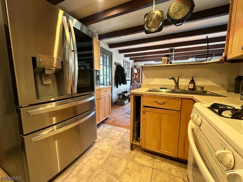 223 Federal Twist Road Stockton, NJ 08559 - Photo 8 of 28 a kitchen with a stove and a refrigerator