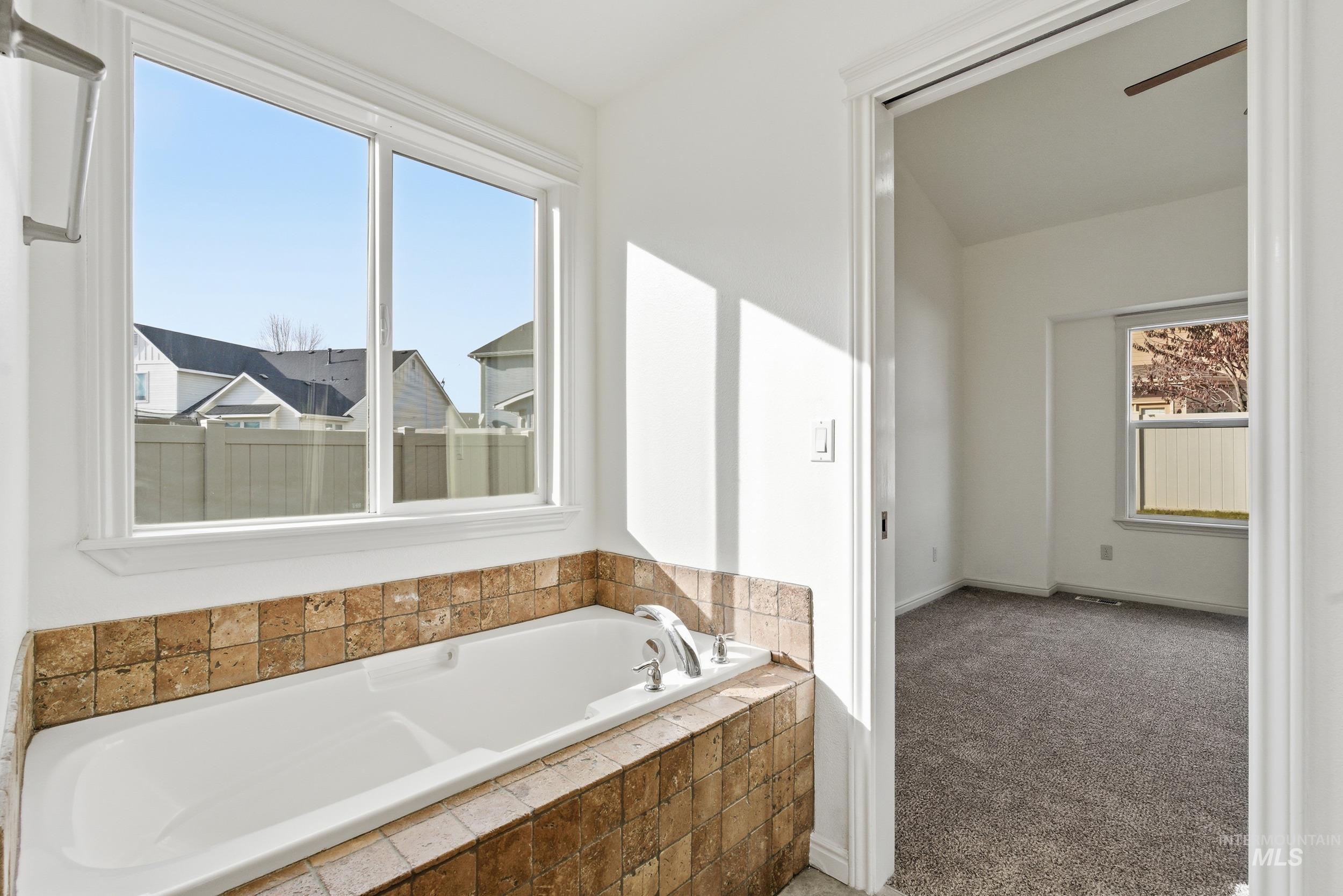 1133 North Powder River Drive Middleton, ID 83644 - Photo 17 of 33 Full bath with carpet floors and a garden tub