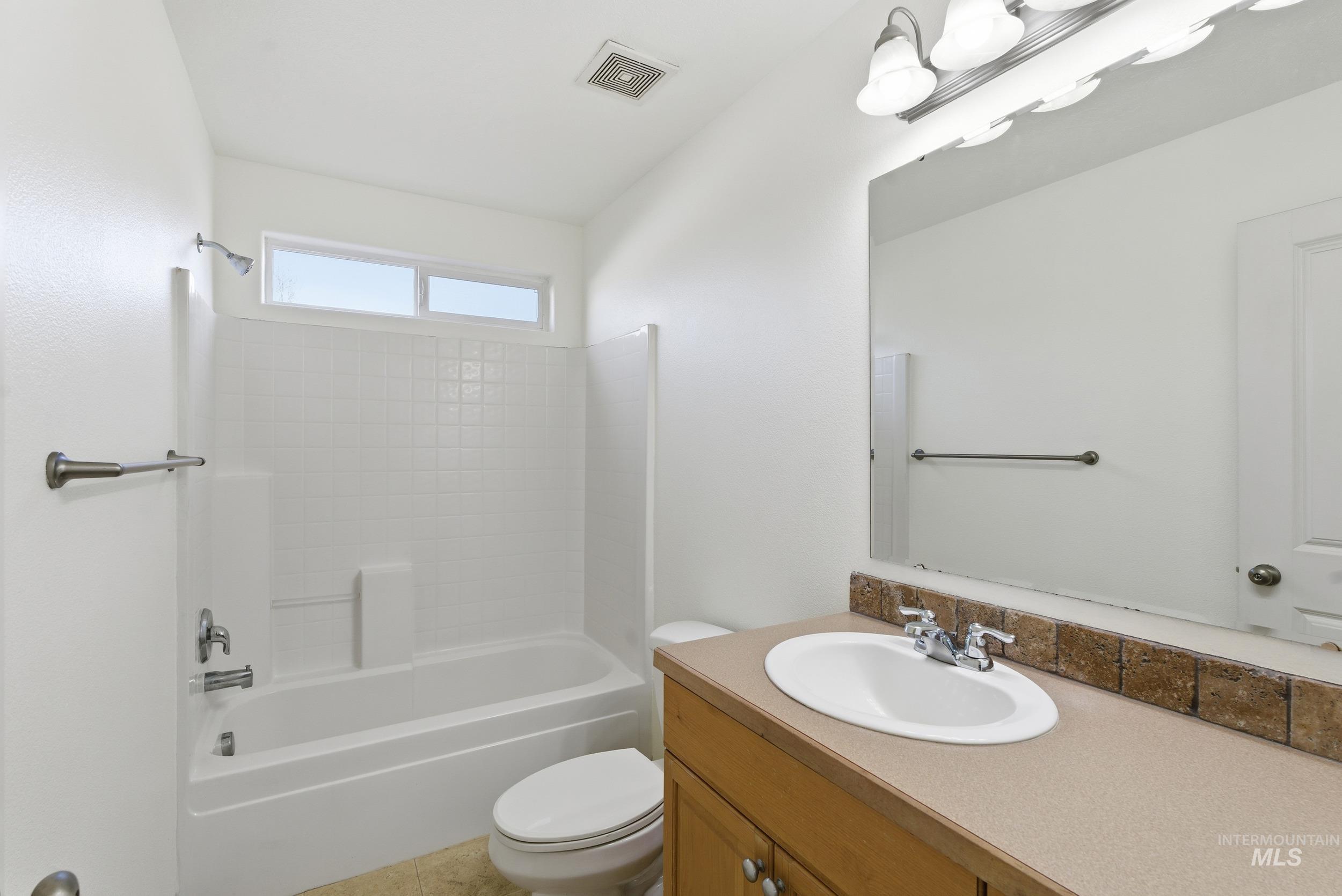 1133 North Powder River Drive Middleton, ID 83644 - Photo 20 of 33 Full bathroom featuring shower combination and vanity