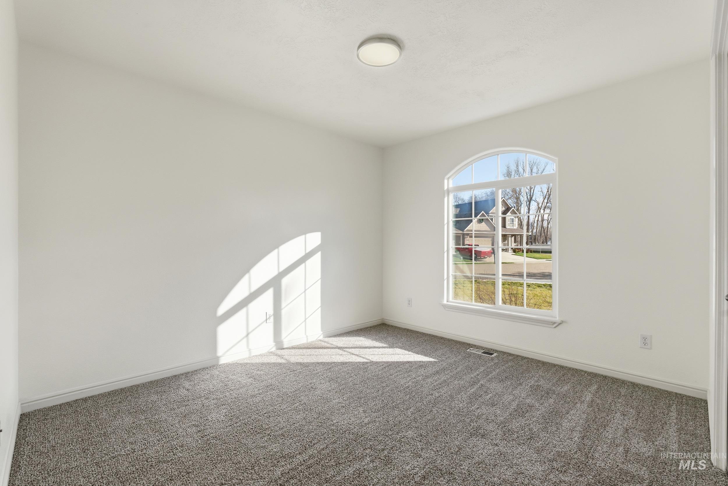 1133 North Powder River Drive Middleton, ID 83644 - Photo 23 of 33 Unfurnished room with carpet and baseboards