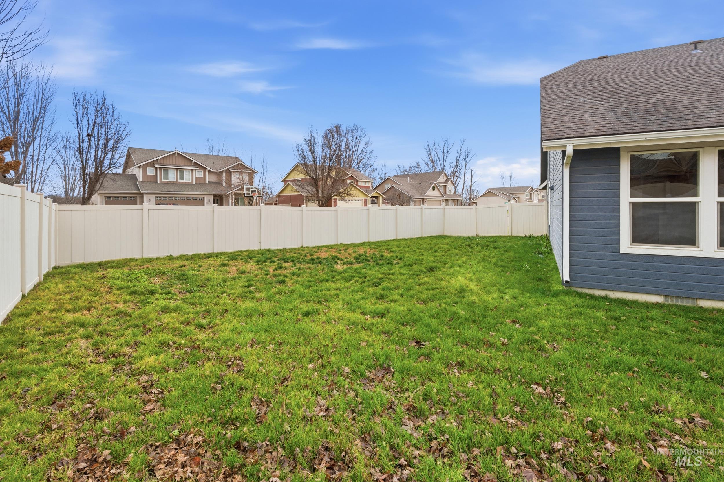 1133 North Powder River Drive Middleton, ID 83644 - Photo 30 of 33 Fenced backyard with a residential view
