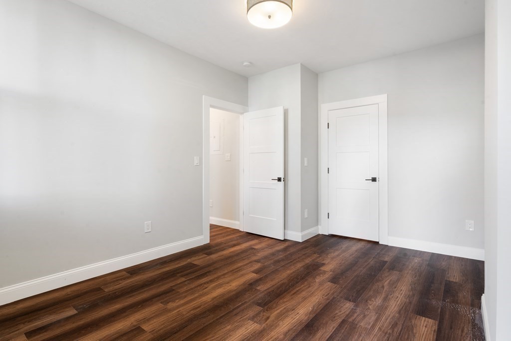 31 Monadnock Street, Unit 2 Boston, MA 02125 - Photo 6 of 11 a view of room with wooden floor