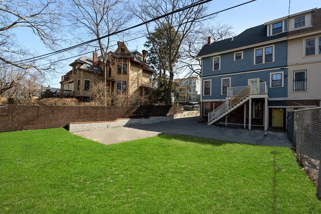 31 Monadnock Street, Unit 2 Boston, MA 02125 - Photo 10 of 11 a view of a house with a yard and a park