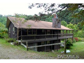 940 Hidden Valley Road Clyde, NC 28721 - Photo 1 of 23 a view of house with a yard