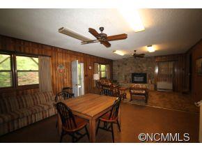 940 Hidden Valley Road Clyde, NC 28721 - Photo 20 of 23 a view of a dining room with furniture and window
