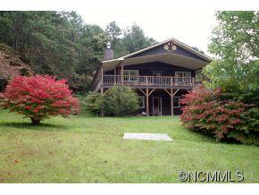 940 Hidden Valley Road Clyde, NC 28721 - Photo 22 of 23 a front view of a house with a garden