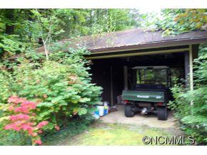 940 Hidden Valley Road Clyde, NC 28721 - Photo 23 of 23 a backyard of a house with seating space