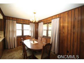 940 Hidden Valley Road Clyde, NC 28721 - Photo 7 of 23 a view of a dining room with furniture and window