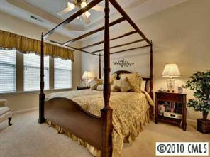 135 Whitley Mills Road Fort Mill, SC 29708 - Photo 6 of 8 a bedroom with a bed and large windows