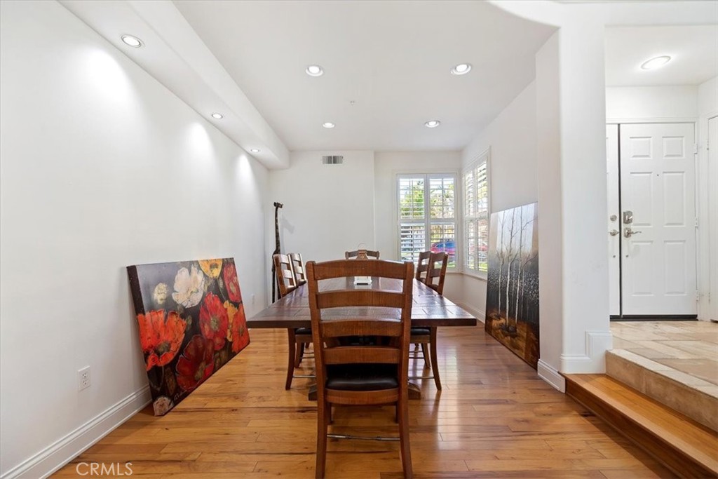 2310 Crown Point Court Oxnard, CA 93036 - Photo 11 of 50 a view of a hallway with wooden floor and furniture