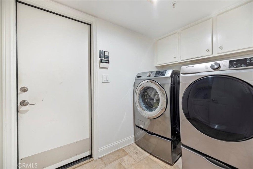 2310 Crown Point Court Oxnard, CA 93036 - Photo 22 of 50 a utility room with dryer and washer