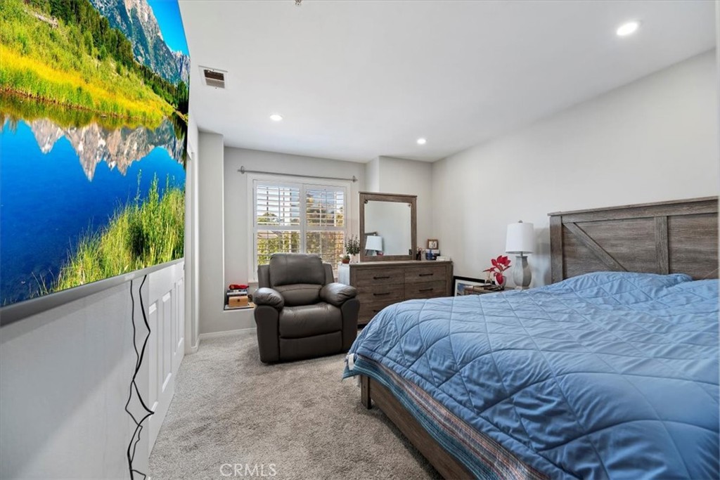 2310 Crown Point Court Oxnard, CA 93036 - Photo 26 of 50 a bedroom with a bed couch and a window