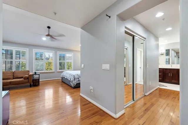 a bedroom with a bed couch and window