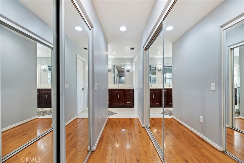 2310 Crown Point Court Oxnard, CA 93036 - Photo 31 of 50 a view of a hallway with wooden floor