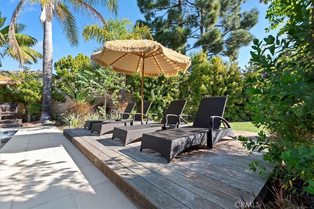 2310 Crown Point Court Oxnard, CA 93036 - Photo 42 of 50 a view of backyard with outdoor seating and trees